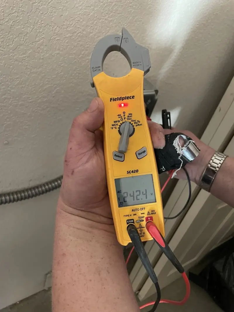 Voltage testing with clamp meter during Recessed Lighting Installation in LaSalle